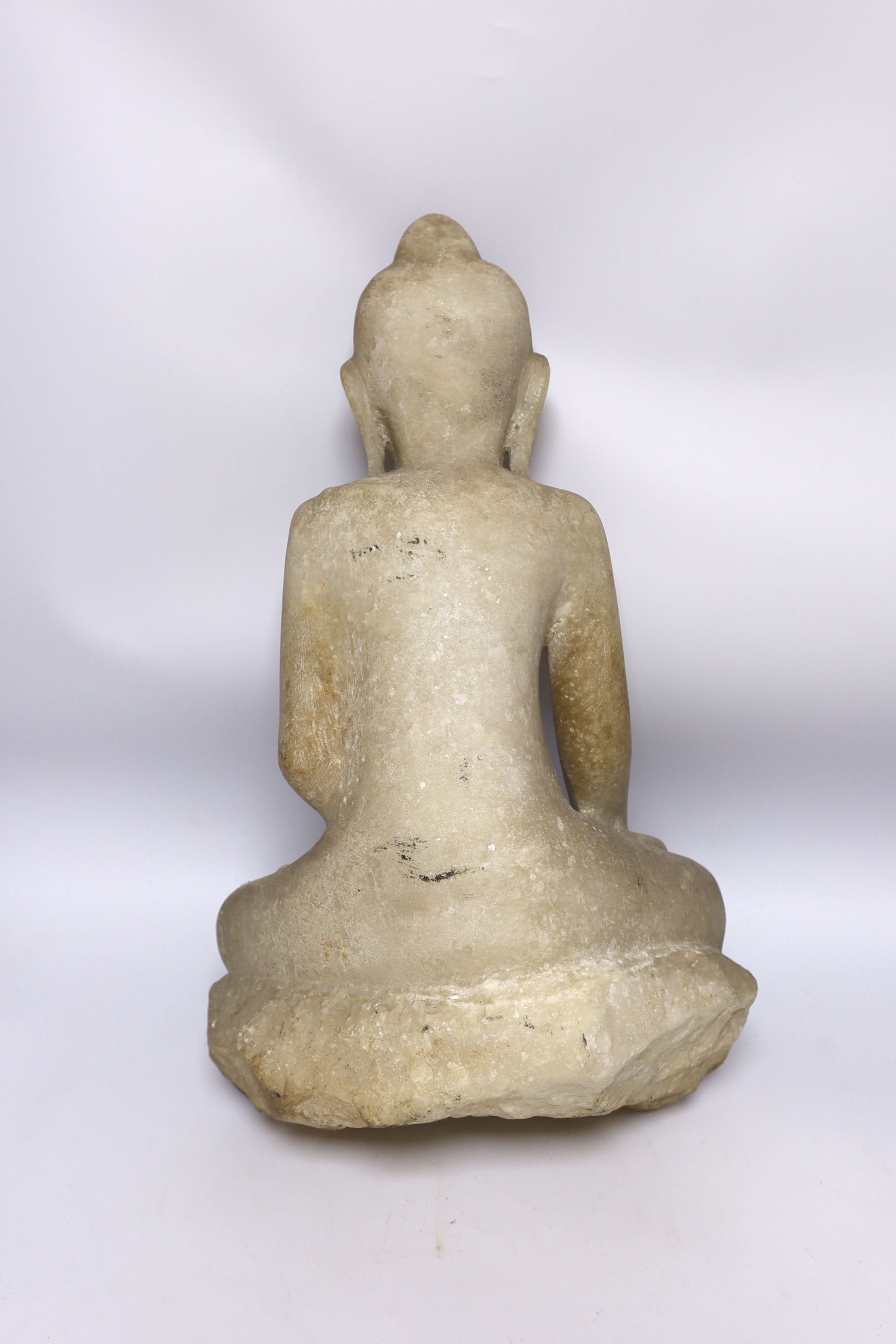 A Burmese carved alabaster model of a seated buddha, 46cm